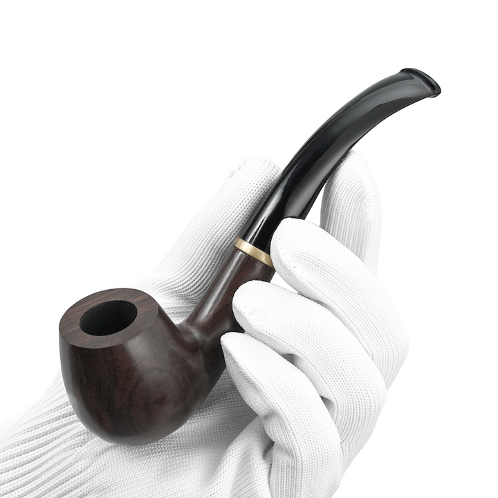 Joyoldelf ebony wood pipe with curved black stem held in a gloved hand.